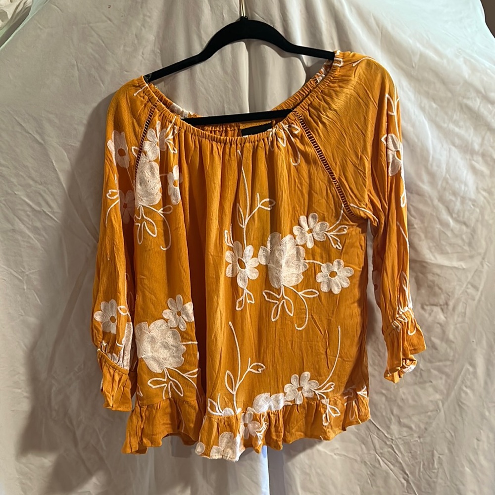Orange embroidered top with flouncy bottom